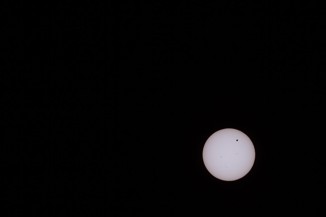  June 05, 2012 - 2012 solar transit of Venus (and a few sun-spots) captured via filtered 400mm on an APS-C dSLR. 1/6400 sec at f/14, ISO 100.
